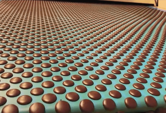 Cacao discs cooling after production, highlighting Ora Cacao's chocolate-making process