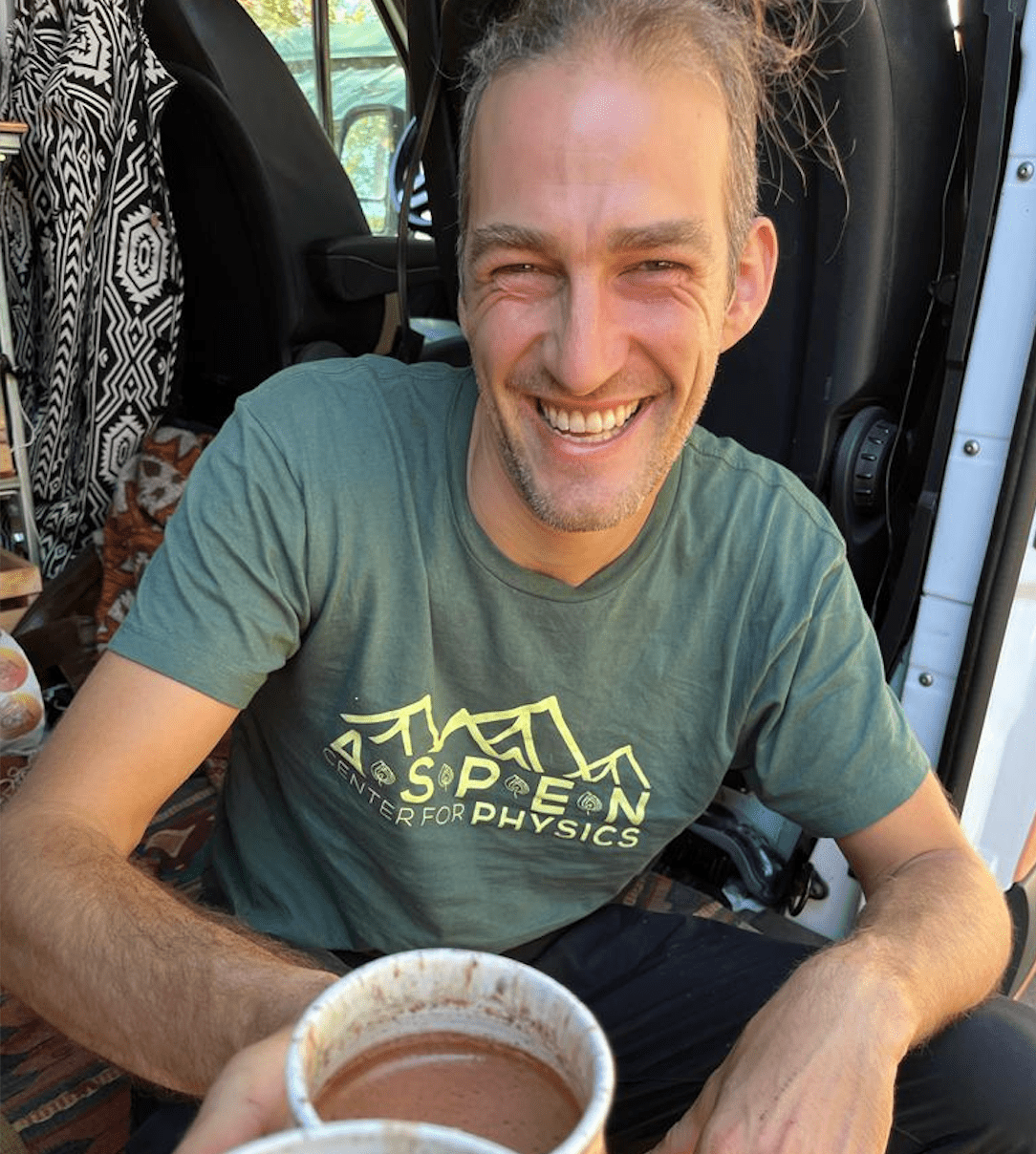 A celebratory image of a person raising a cacao cup, symbolizing wellness and gratitude