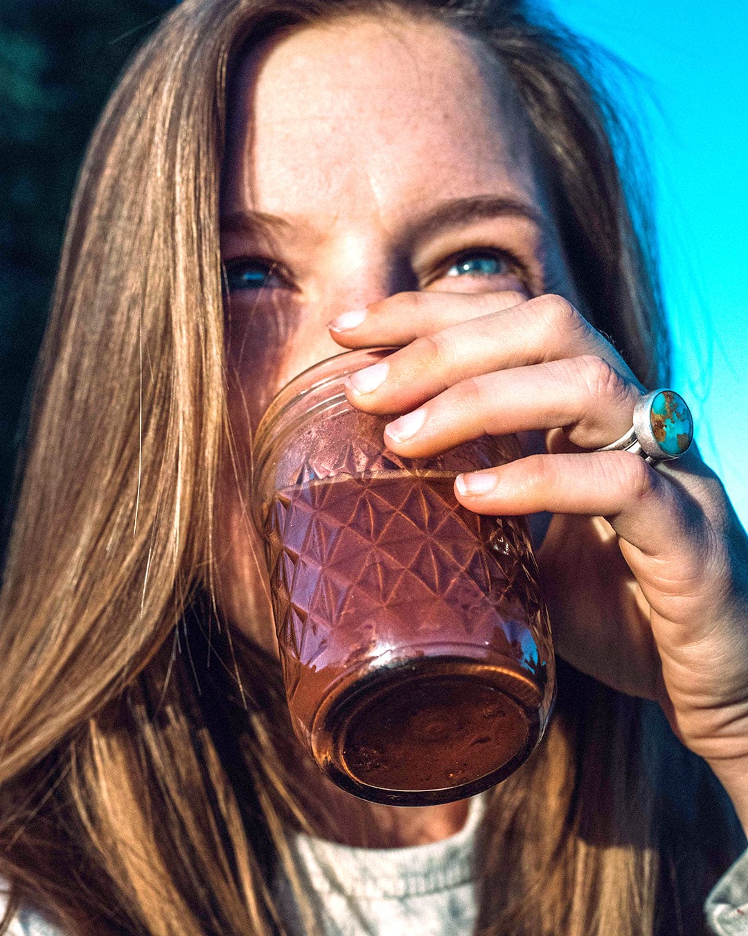 Elsa enjoying a warm cup of cacao, capturing a cozy and tranquil moment